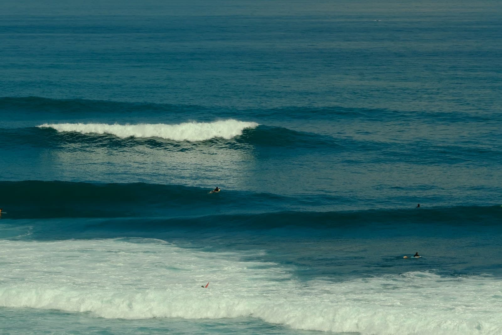 Surfer riding a wave in Bali