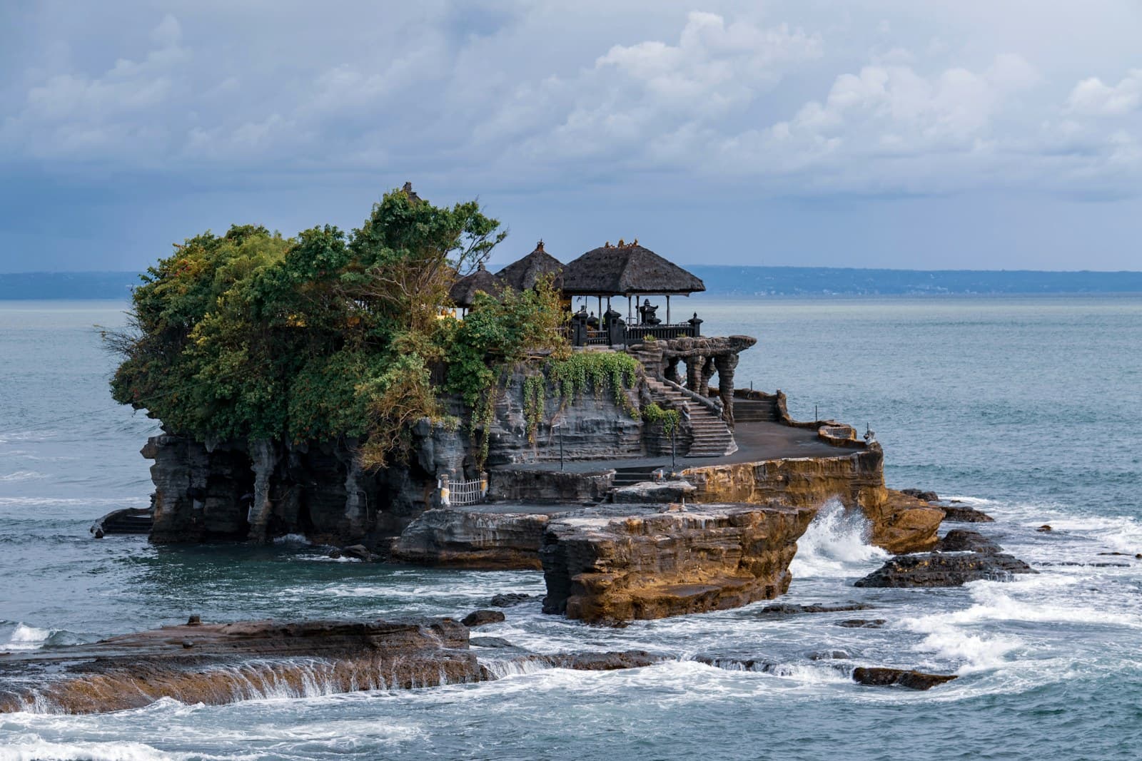 Tanah Lot sea temple on a rock at sunset