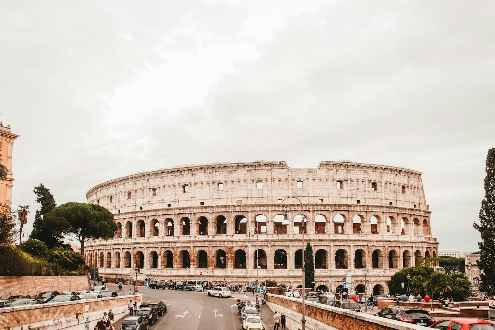 Roman Colosseum exterior with arches at golden hour