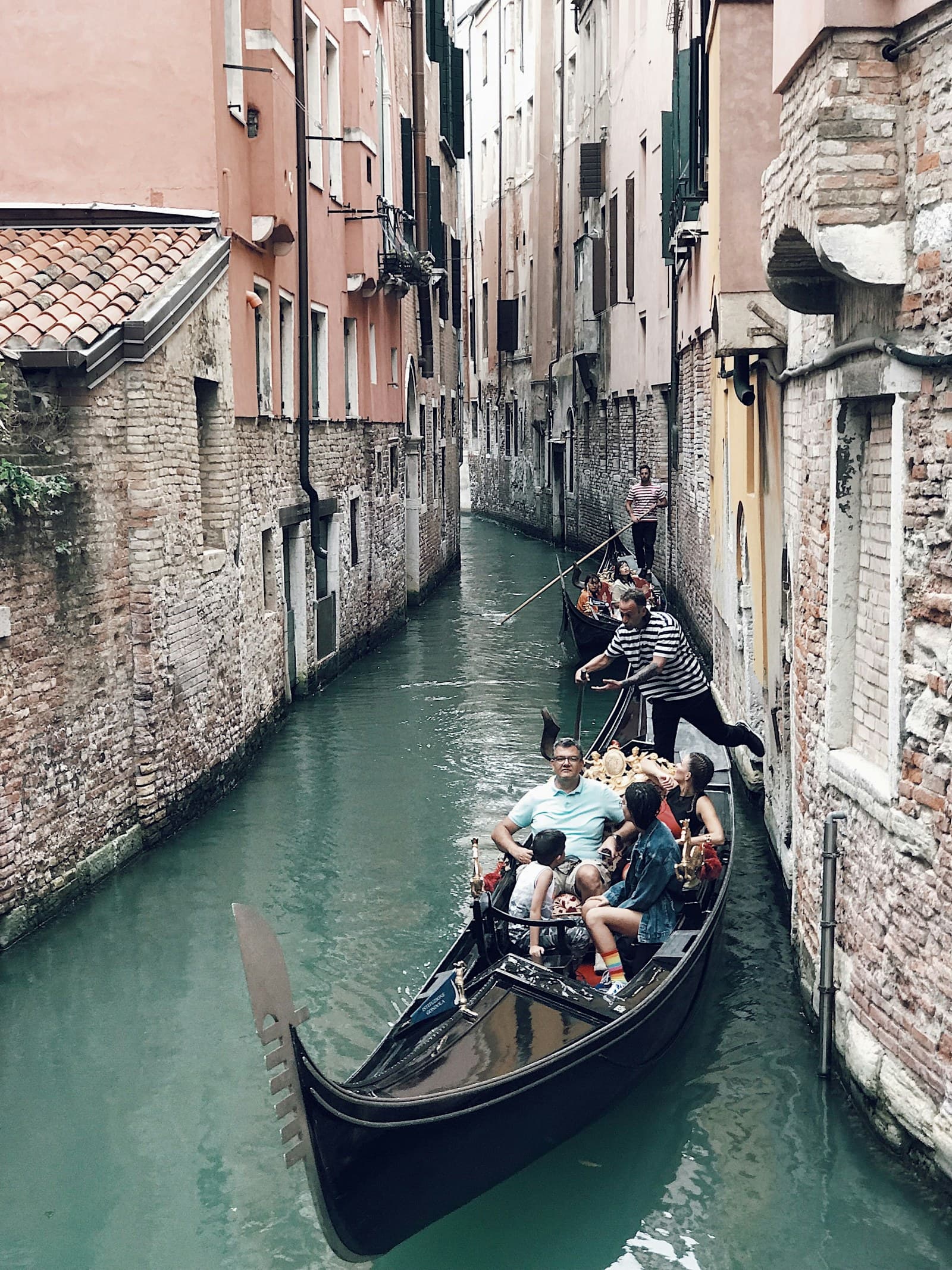 Gondolas on a Venice canal with historic buildings