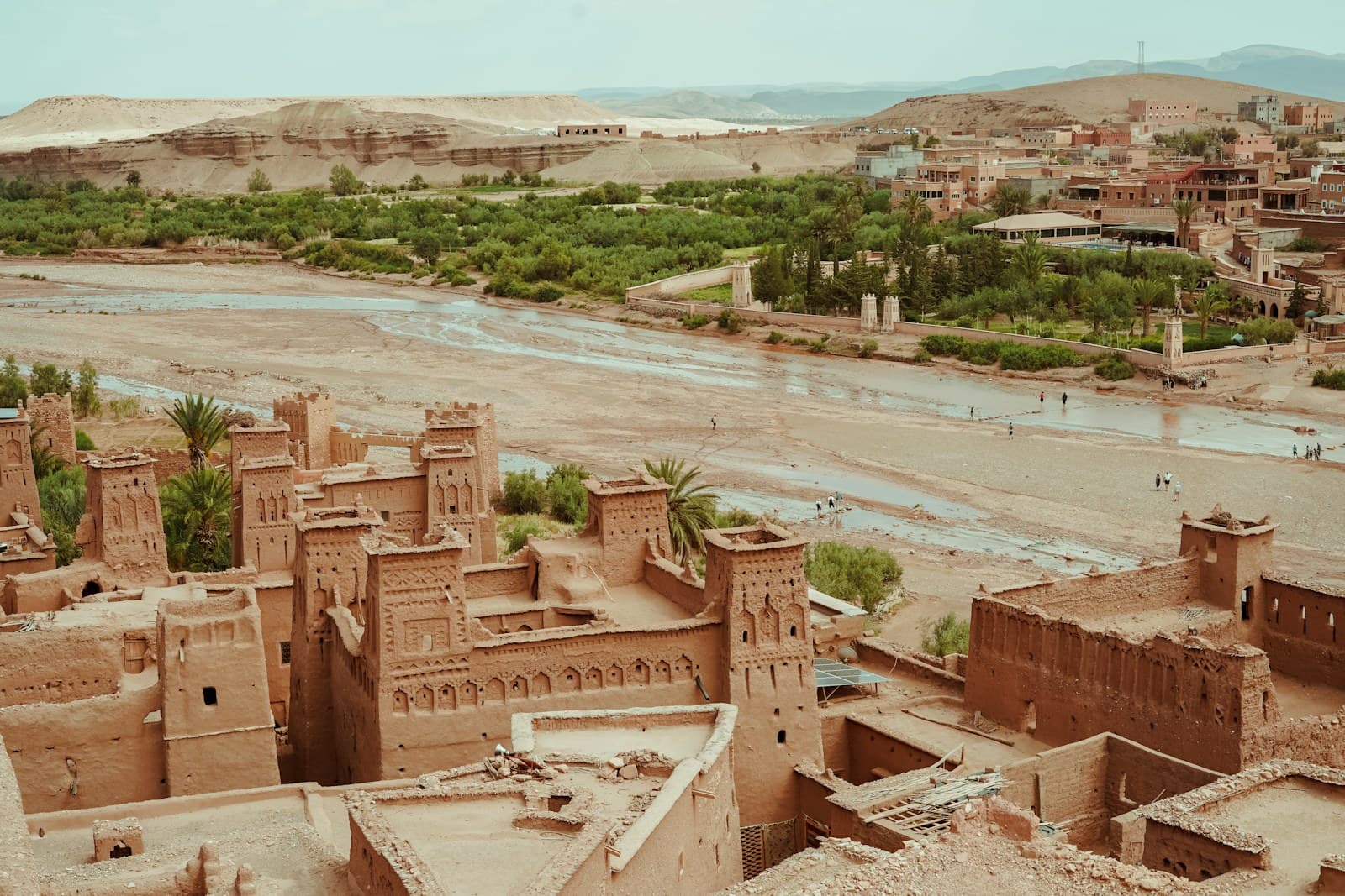 Clay kasbah of Aït Benhaddou with palm trees