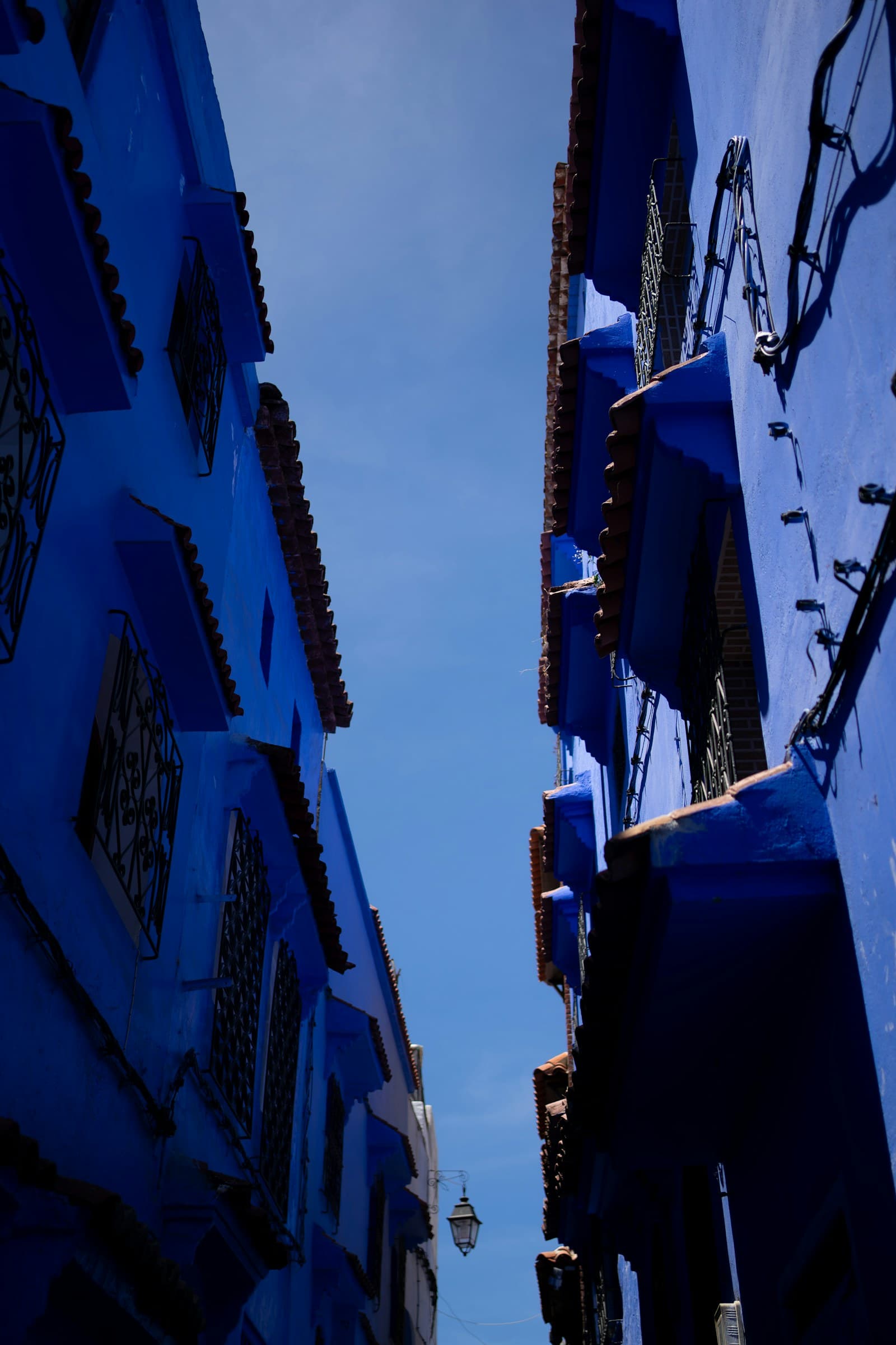 Blue-painted alley in Chefchaouen Morocco