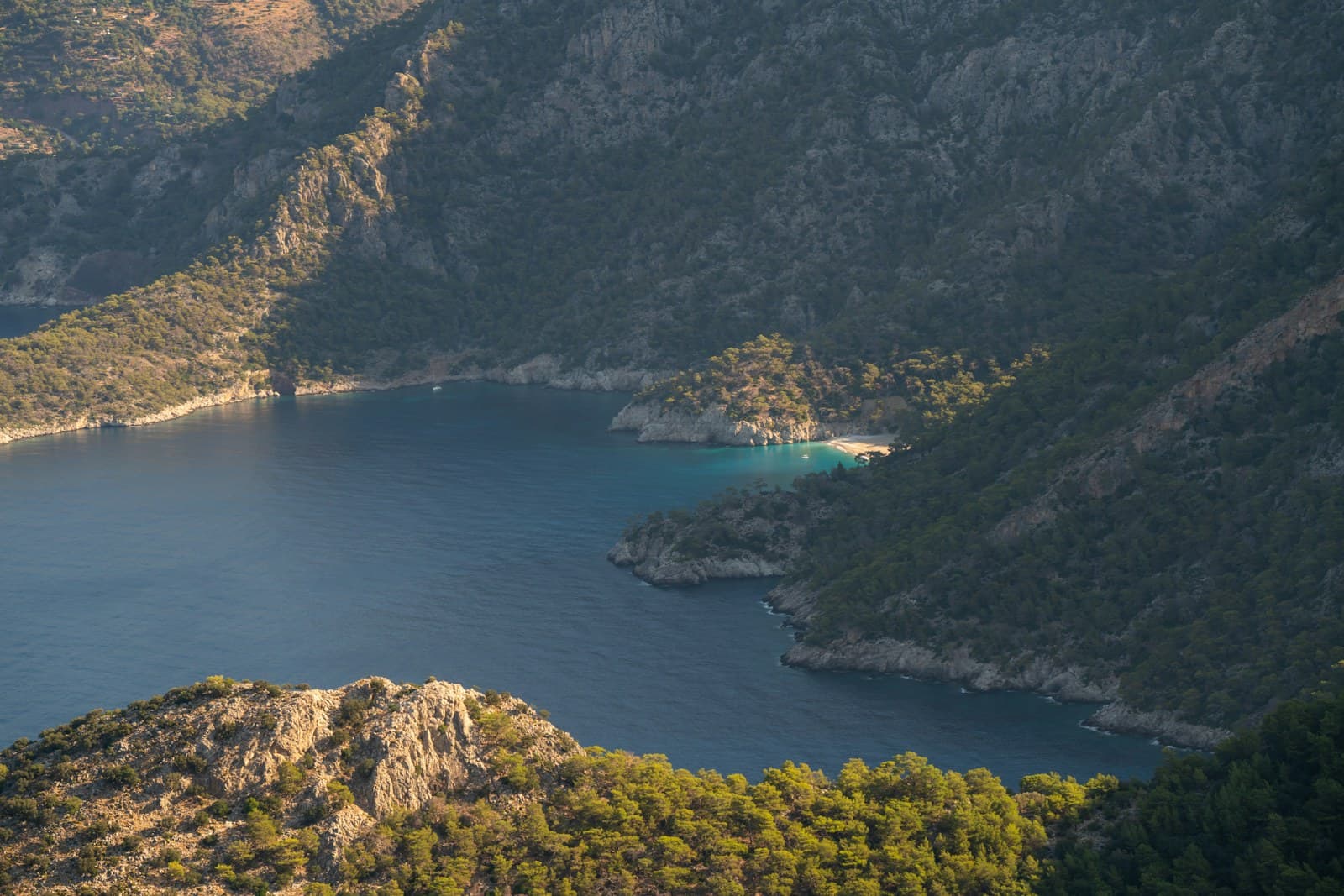 Turquoise lagoon of Ölüdeniz with paragliders