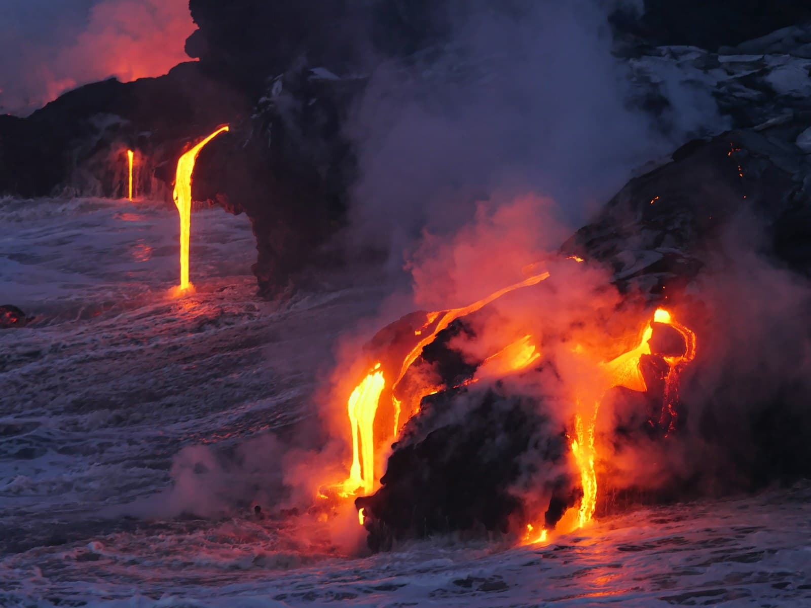 Hawaiian beach with lava rocks and palm trees