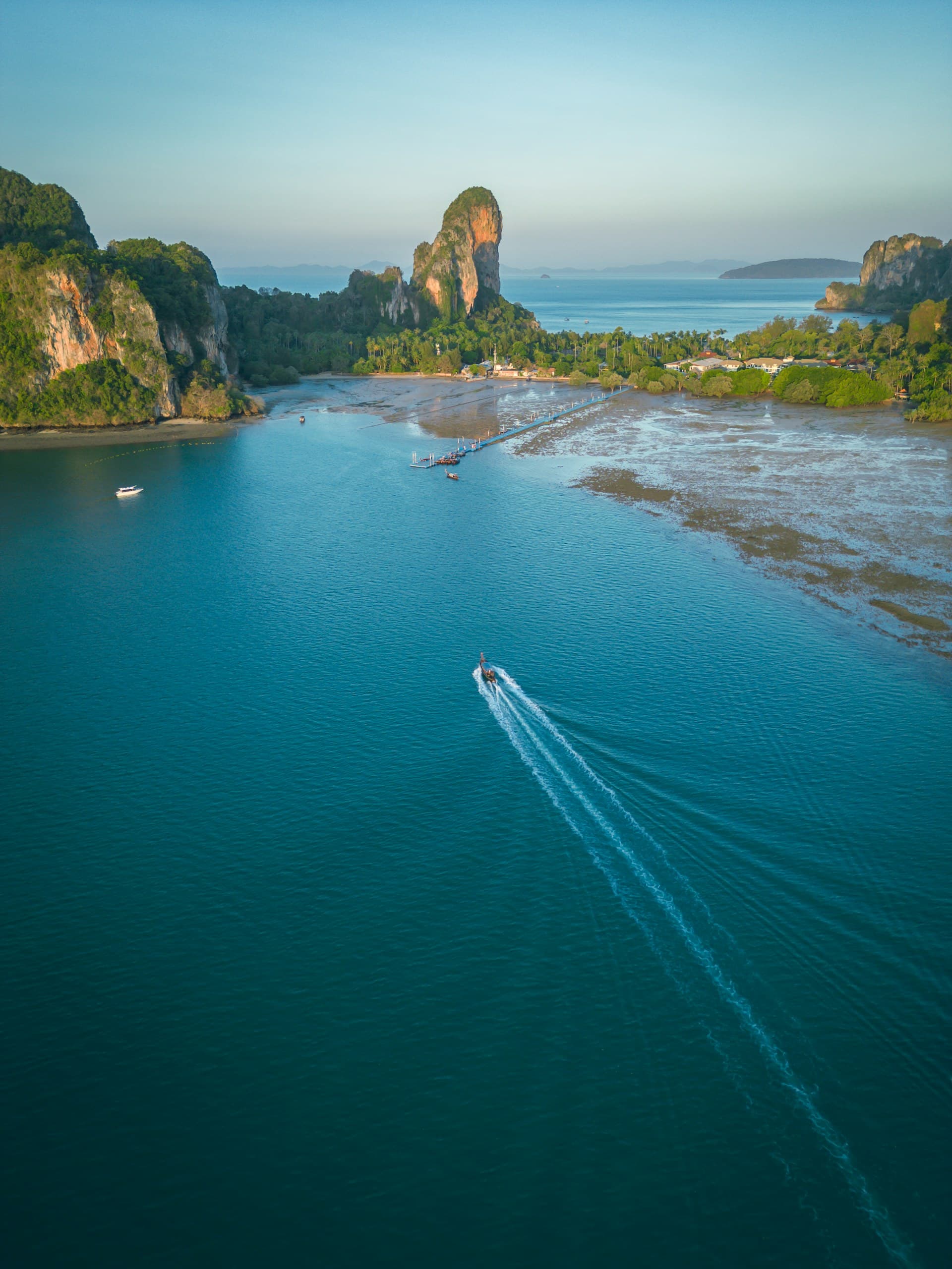 Thai longtail boats on turquoise water at Railay beach, Krabi